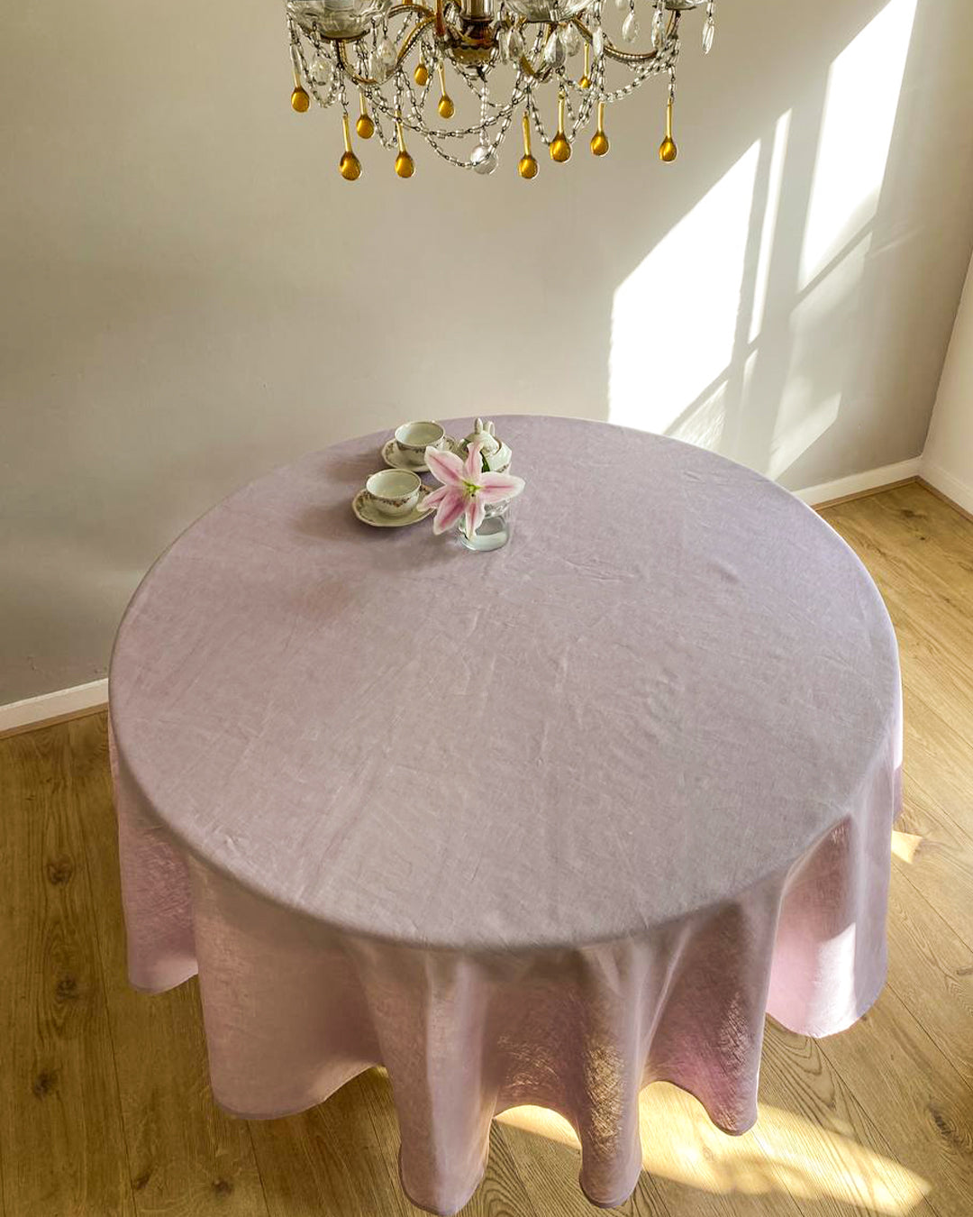 Round tablecloth from soft linen in lilac