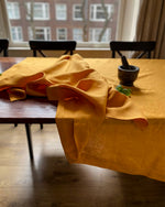 Load image into Gallery viewer, Tablecloth from soft linen in Safran
